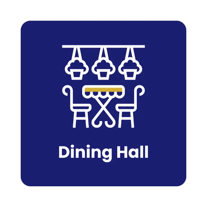 Communal dining room with large tables and student seating
