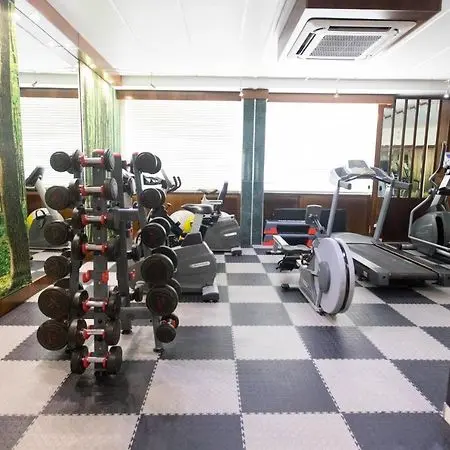 On-site gym facility with weights and cardio equipment for student wellness at Burgers Park Student Hotel